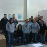 The Nursing Mountain West and Advanced Practice teams sorting food for the Open Door Mission